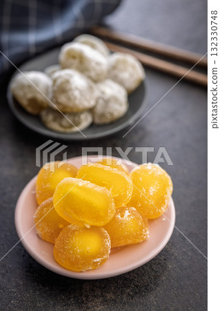 Japanese mochi dessert on plate on black table. Japanese mochi dessert on plate on black table. 132330748