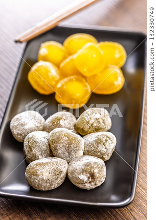 Japanese mochi dessert on plate on wooden table. Japanese mochi dessert on plate on wooden table. 132330749