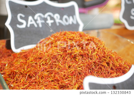 Vibrant saffron displayed in a market setting 132330843