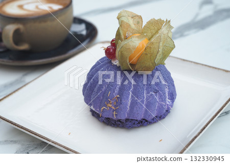 Delicious purple dessert with coffee on a marble table 132330945