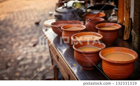 India Street Food, Roadside stall serving piping hot masala chai in clay cups., copy space India Street Food, Roadside stall serving piping hot masala chai in clay cups., copy space 132331319