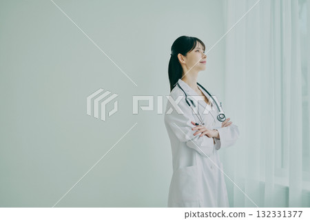 Female doctor standing by the window 132331377