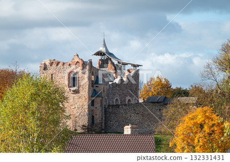 the roof of a building on the background of a hill with an ancient medieval castle the roof of a building on the background of a hill with an ancient medieval castle 132331431