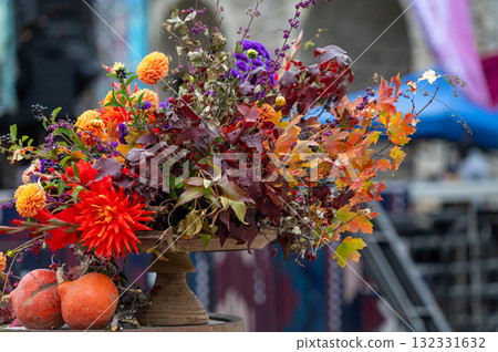 Autumn flower bouquets and vegetable composition on defocused background with copy space for text Autumn flower bouquets and vegetable composition on defocused background with copy space for text 132331632