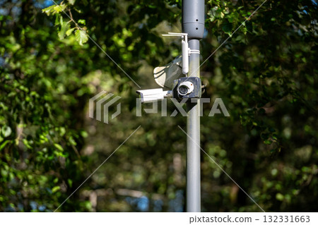 Surveillance camera security cam in the park Surveillance camera security cam in the park 132331663