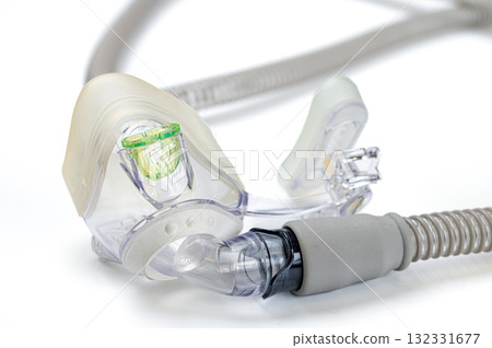 Respiratory mask for sleep disorders isolated over white. Apnea. Air pump. Assisted breathing. Respiratory mask for sleep disorders isolated over white. Apnea. Air pump. Assisted breathing. 132331677