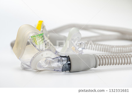Respiratory mask for sleep disorders isolated over white. Apnea. Air pump. Assisted breathing. Respiratory mask for sleep disorders isolated over white. Apnea. Air pump. Assisted breathing. 132331681
