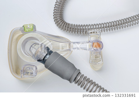 Respiratory mask for sleep disorders isolated over white. Apnea. Air pump. Assisted breathing. Respiratory mask for sleep disorders isolated over white. Apnea. Air pump. Assisted breathing. 132331691