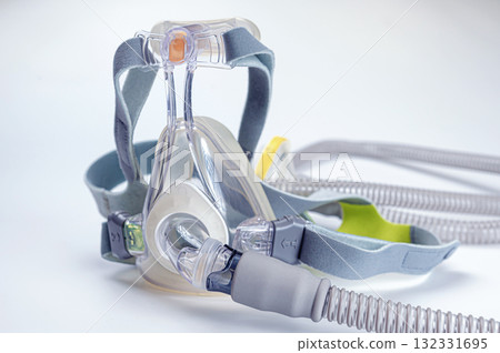 Continuous positive airway pressure- mask (CPAP) and hose isolated on white background 132331695