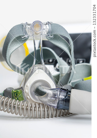 Continuous positive airway pressure system includes of CPAP machine, mask, tube on white background. 132331704