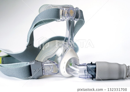 Continuous positive airway pressure- mask (CPAP) and hose isolated on white background 132331708