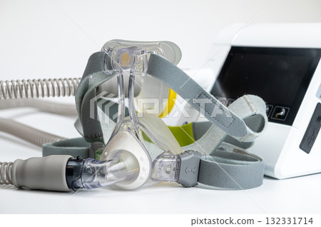 Continuous positive airway pressure system includes of CPAP machine, mask, tube on white background. 132331714