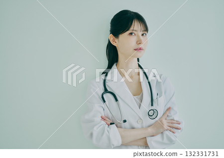 Female physician with arms Female physician with arms 132331731