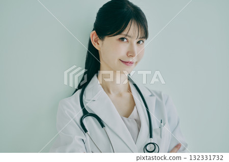 Female physician with arms Female physician with arms 132331732