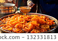 India Street Food, Golden jalebis being fried and dipped in sugar syrup at a bustling market 132331813