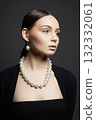 Beautiful young woman with pearl necklace 132332061