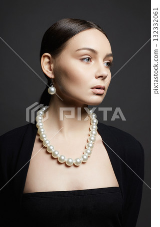 Beautiful young woman with pearl necklace Beautiful young woman with pearl necklace 132332061