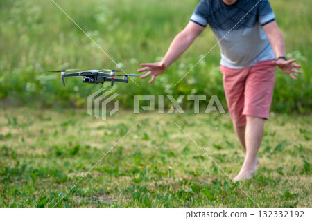 A man launches a drone into the air. The concept of remote control. Selective focus 132332192