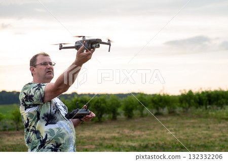 A drone lands on the hand of a man after a successful flight. 132332206