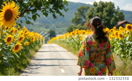 A beautiful woman in a kimono walking through a sunflower field A beautiful woman in a kimono walking through a sunflower field 132332358