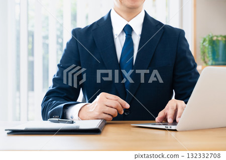 Businessman using a personal computer Businessman using a personal computer 132332708