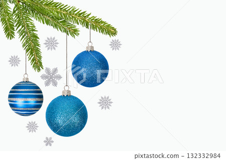 Christmas background with green Christmas tree branches, blue and striped balls, and silver snowflakes with copy space. New Year and Christmas card. Christmas background with green Christmas tree branches, blue and striped balls, and silver snowflakes with copy space. New Year and Christmas card. 132332984