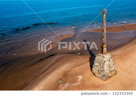 old ruins of Kurmrags Lighthouse on the shore of the Rigas Gulf, Baltic sea, Latvia 132333393