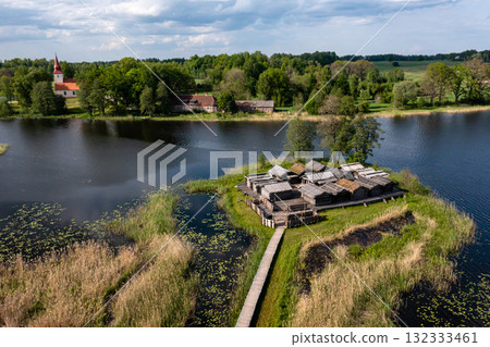 view from above of ancient wooden settlement on river island, recontruction of ancient architecture 132333461