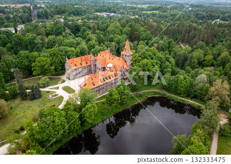 Cesvaine medieval castle in Latvia from above. Building of stones with a brown tiled roof. 132333475