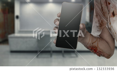 Zombie hands with wounds and blood holding a cellphone on the abandoned building. Mockup or Copy space. The scene is scary and creepy. Concept of Spooky Halloween Zombie hands with wounds and blood holding a cellphone on the abandoned building. Mockup or Copy space. The scene is scary and creepy. Concept of Spooky Halloween 132333936