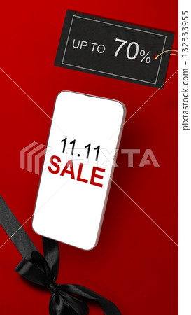 11.11 sale text on cellphone screen with up to 70% text on the label tag. Copy space. Flash sale concept 132333955