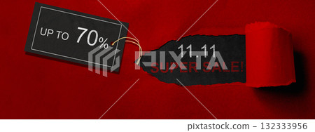 Top view of red ripped paper and text of 11.11 super sale with up to 70% text on the label tag. Copy space. Flash sale concept Top view of red ripped paper and text of 11.11 super sale with up to 70% text on the label tag. Copy space. Flash sale concept 132333956