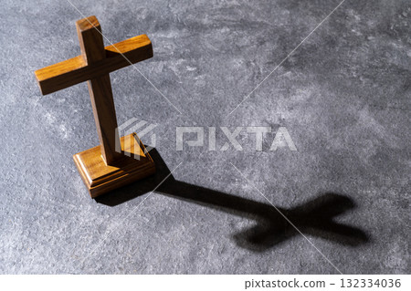 Christian cross on the table. Concept of Christianity, religious, faith, Jesus, or belief 132334036