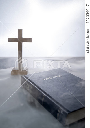 Blue book of the Holy bible and Christian cross. Standing on the table with a light background. Symbol of faith in God. Concept of Spirituality, Christianity, religion, faith, Jesus, or belief Blue book of the Holy bible and Christian cross. Standing on the table with a light background. Symbol of faith in God. Concept of Spirituality, Christianity, religion, faith, Jesus, or belief 132334047
