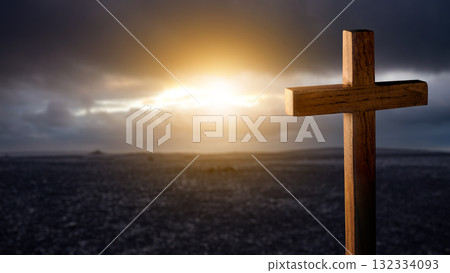 Christian cross with landscape view and dark dramatic sky background. Concept of Christianity, religious, faith, Jesus, or belief Christian cross with landscape view and dark dramatic sky background. Concept of Christianity, religious, faith, Jesus, or belief 132334093