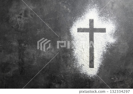 Christian cross formed by a dusting of white powder on the table. Concept of Christianity, religious, faith, Jesus, or belief Christian cross formed by a dusting of white powder on the table. Concept of Christianity, religious, faith, Jesus, or belief 132334297