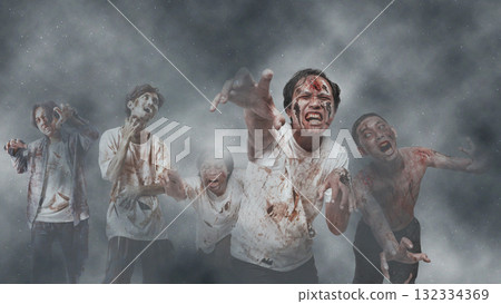 Group of Indonesian southeast asian scary male zombies with wounds and blood were walking. The scene is scary and creepy. Dramatic smoke or fog effect. Concept of Spooky Halloween Group of Indonesian southeast asian scary male zombies with wounds and blood were walking. The scene is scary and creepy. Dramatic smoke or fog effect. Concept of Spooky Halloween 132334369
