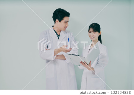 Men and women in white coats 132334828
