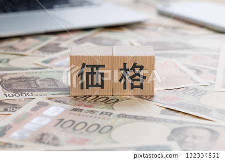 A block with the word price written on it 132334851