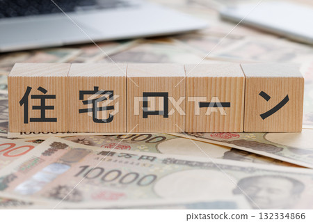 A block with the word mortgage written on it on top of money 132334866