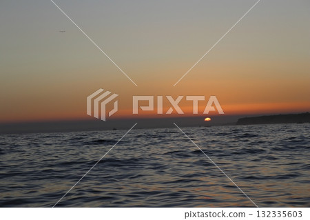 Golden Sunset Over Atlantic Ocean in Algarve, Portugal 132335603