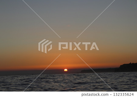 Golden Sunset Over Atlantic Ocean in Algarve, Portugal 132335624