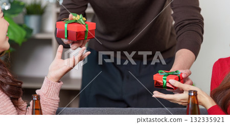 Gift Exchange During Happy New Year Celebration Gift Exchange During Happy New Year Celebration 132335921