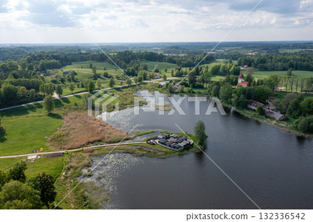view from above of ancient wooden settlement on river island, recontruction of ancient architecture view from above of ancient wooden settlement on river island, recontruction of ancient architecture 132336542