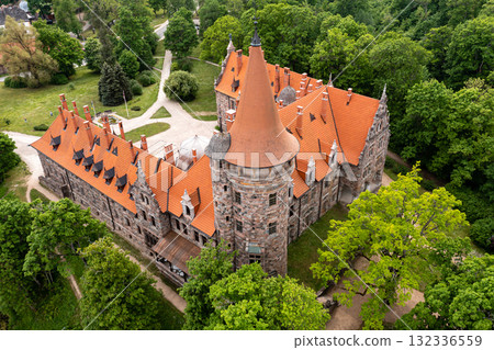 Cesvaine medieval castle in Latvia from above. Building of stones with a brown tiled roof. 132336559