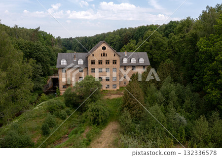 The ancient Katrina mill building in a picturesque location by the lake, Krimulda, Latvia 132336578