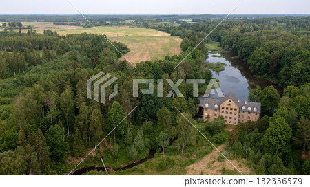 The ancient Katrina mill building in a picturesque location by the lake, Krimulda, Latvia 132336579