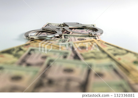 handcuffs on money background, dollar bills, money cash corruption, dirty money, police handcuffs handcuffs on money background, dollar bills, money cash corruption, dirty money, police handcuffs 132336881