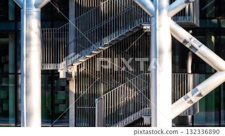 staircase with metal stairs and railings leading upwards, an element of urban architecture staircase with metal stairs and railings leading upwards, an element of urban architecture 132336890