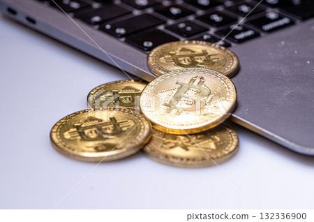 golden Bitcoin cryptocurrency coins on laptop keyboard, cryptocurrency and digital payment system golden Bitcoin cryptocurrency coins on laptop keyboard, cryptocurrency and digital payment system 132336900